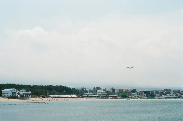 Flight over Jeju Island. Source: Photo by Finn on Unsplash