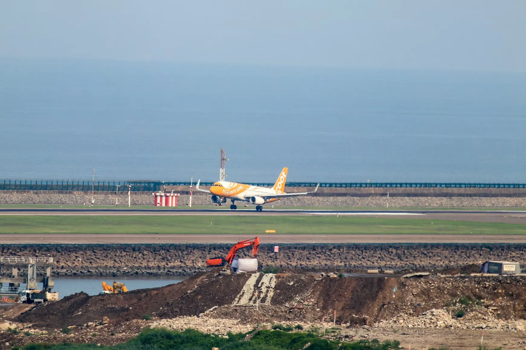 An airplane landing at Macau International Airport. Source: Photo by Renato Marques/unsplash.com