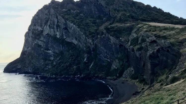 Witness the volcanic landscape of the Seongsan Ilchulbong Peak on Jeju