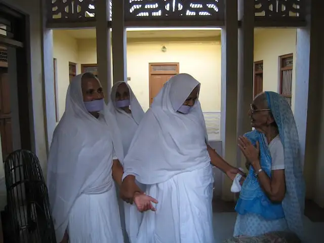Followers of Jainism wearing masks to avoid swallowing insects in India