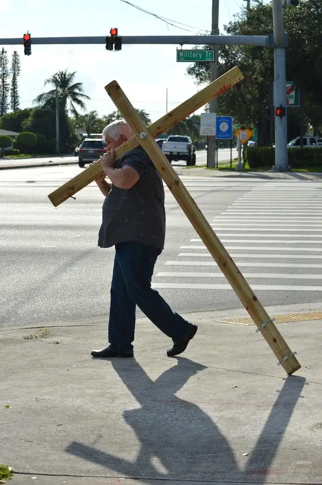 Good Friday 2024 - Man carrying a cross for penance.