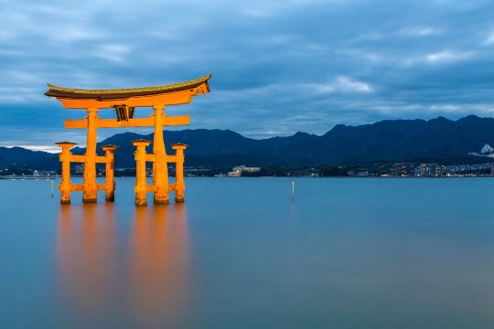 Itsukushima Shrine's famous floating torii gate at sunset, Miyajima, Hiroshima Prefecture, Japan