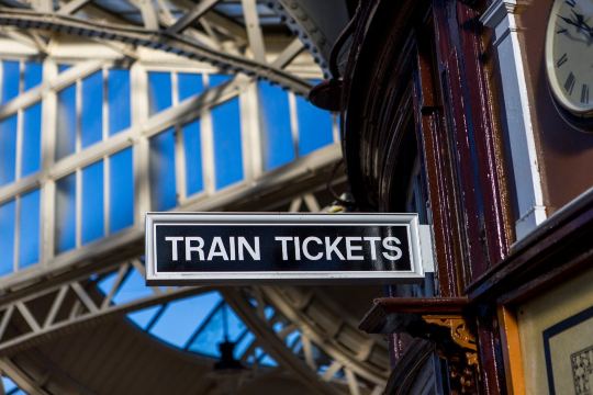 Train tickets sign at UK railway station.