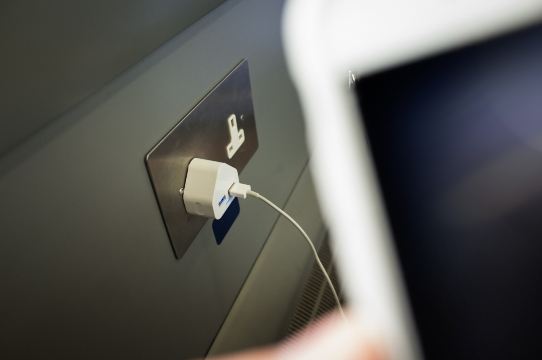 USB charging port on train for dead phone.
