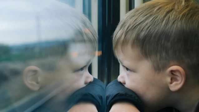 A child by train window