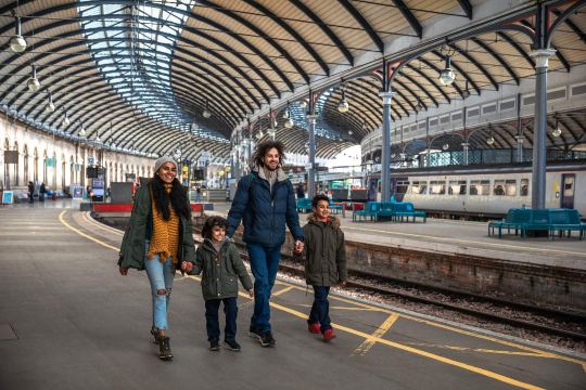 Family travelling by train in the UK