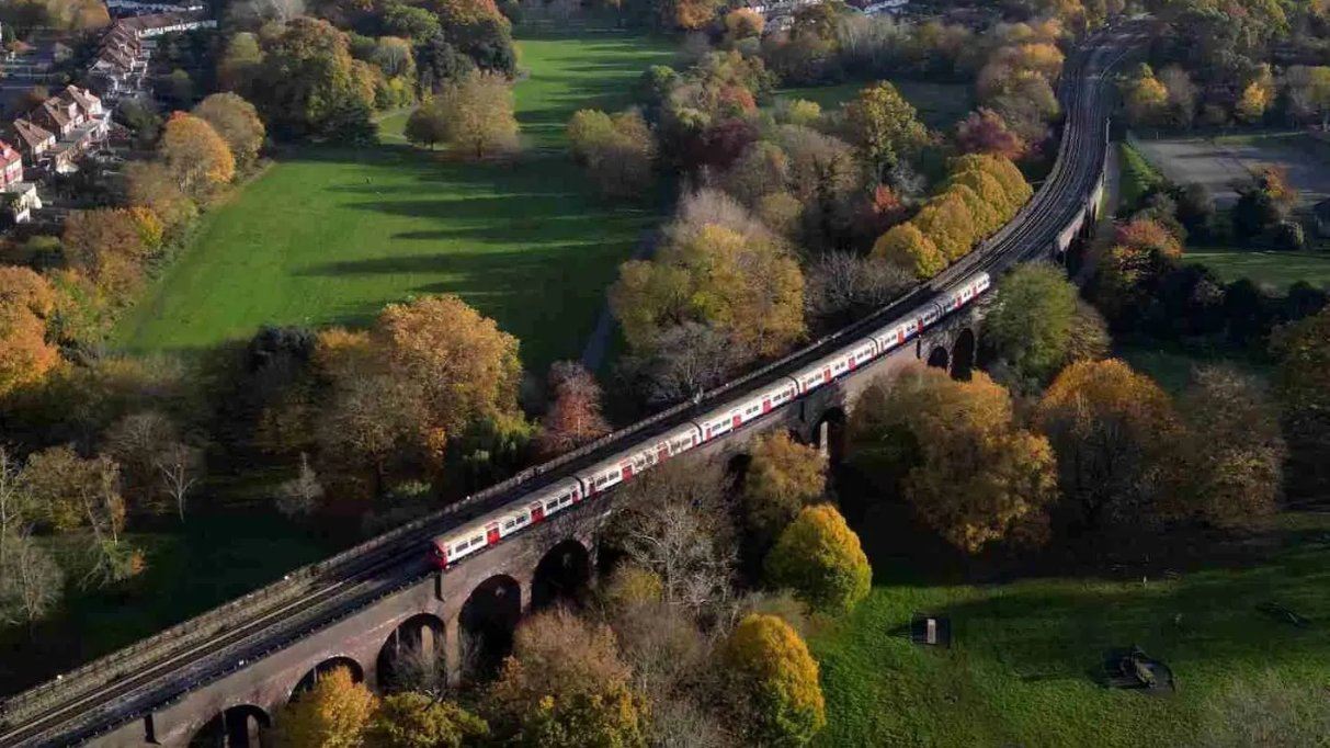 Train crossing a countryside viaduct