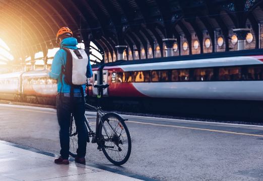 Cyclist waiting on a train platform