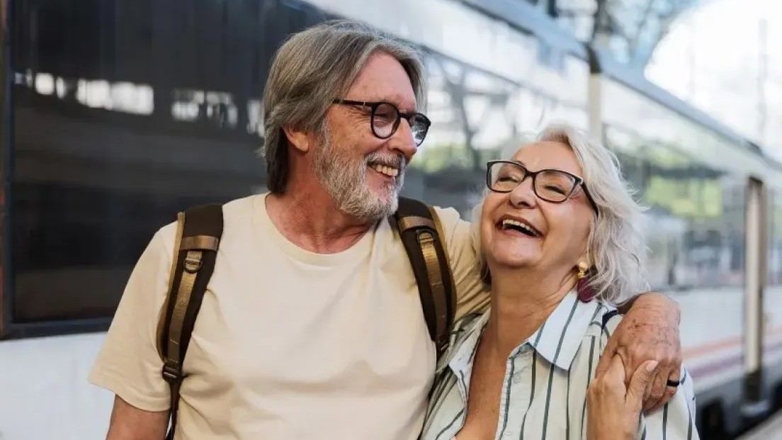 Senior couple train travel