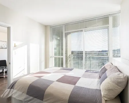 Coquitlam Center Bright & Modern 1BR Parking included Steps to SkyTrain | Pool & Gym Hotels in Coquitlam