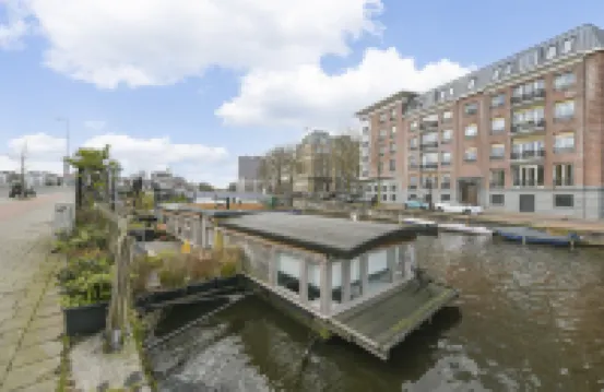 HouseBoat next to AMSTEL
