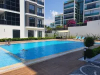 A dreamy luxury one-bedroom apartment with special views of the forest, sea and sunset - مسبح غير متناهي