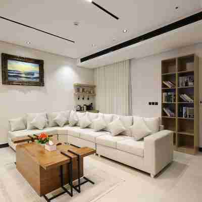Two bedrooms and a living room with a swimming pool Others