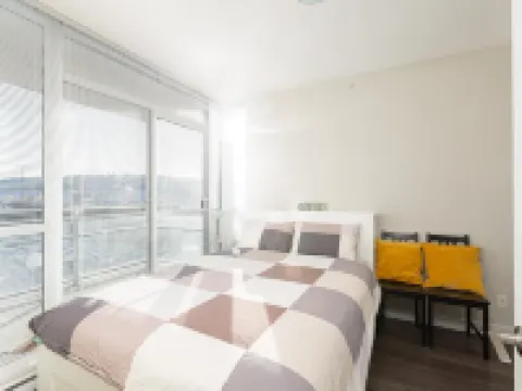Coquitlam Center Bright & Modern 1BR Parking included Steps to SkyTrain | Pool & Gym Hotels in Coquitlam