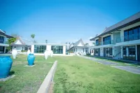 Seven-Colored Oasis Hotels near Kombat Group Thailand