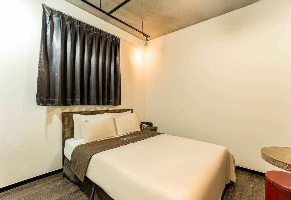 호텔 하라스 영등포의 포근한 침실 전경