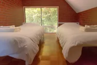 A private cottage in the forest, limited to one group per day — undo