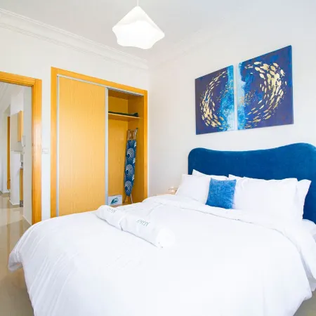Bright Blue Retreat | Balcony & Pool