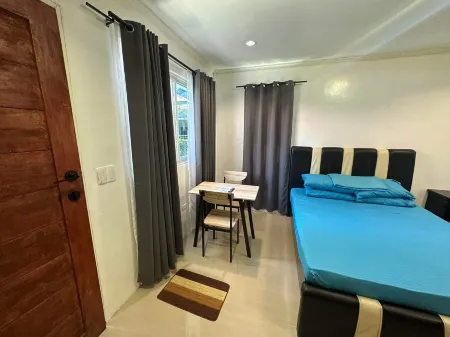 Cozy Studio Type unit w/ TV, Wifi, hotshower & ref Отели в г. Котабато