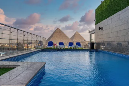 Pyramids Yard Hotel Отели в г. Kafr Nassar
