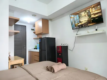 Apartemen amazana cheapest,cozy with wifi,pool and gym by luckystay