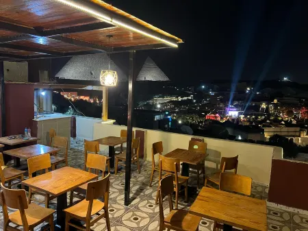 Cheristo Pyramids View Inn Отели в г. Kafr Nassar