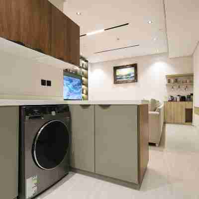 Two bedrooms and a living room with a swimming pool Others