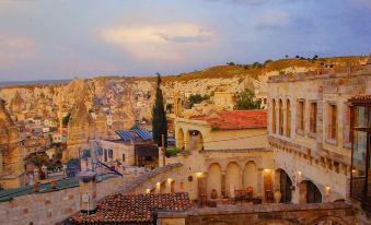 a city view with a mix of old and new buildings , some of which are old and white at Sultan Cave Suites