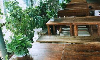 The interior design of Person's Tea Room in Hong Kong features wood paneling at Paoju Factory Youth Hostel (Beijing Summer Palace Subway Station Branch)