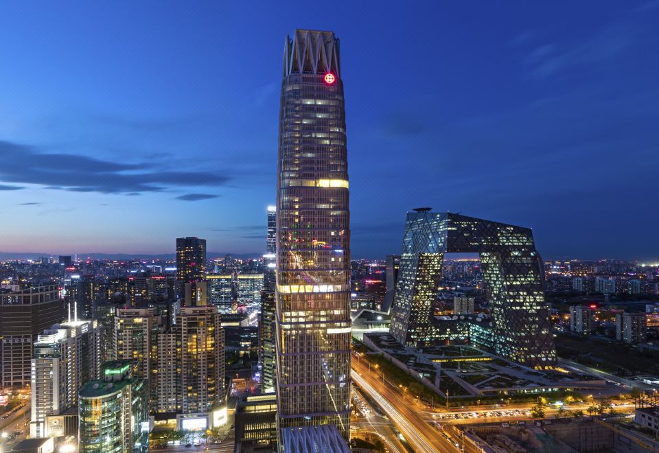 cityscape with buildings and skyline illuminated at night at Jen Beijing by Shangri-La