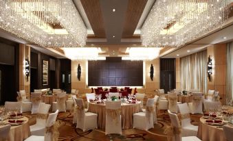A wedding ballroom is prepared with tables and chairs for the event at a hotel or alternative venue at Courtyard by Marriott Shanghai Central