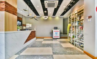The lobby or reception area at Hotel 105 Vista Taft in K is in need of review and revision to eliminate grammatical inaccuracies and improve clarity, fluency, and coherence while summarizing the main information in one sentence at Yimi Hotel (Guangzhou Sanyuanli Subway Station Jinlong Tengfei Fashion City Branch)