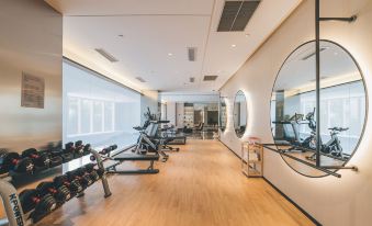The home features a spacious gym and an open concept design for its private living area at Atour Hotel (Yiwu International Trade City)