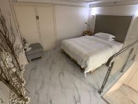 雪域公寓(广州花都融创万达店) - 精选复式大床房