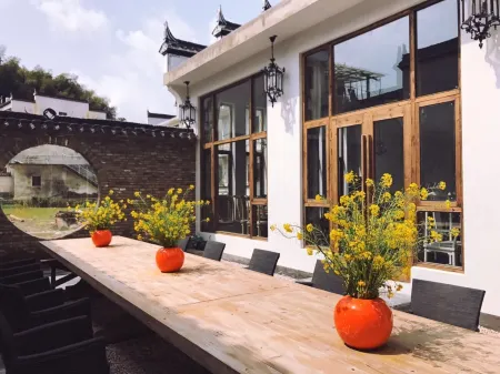 Nanxiangzi Xifu Yinju Hotel Отели рядом с достопримечательностью «Guzhang Folklore Garden»