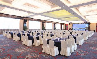 The hotel offers a spacious ballroom equipped with tables and chairs, suitable for hosting weddings and other events at YiWu Zhonglian Kaixin Hotel