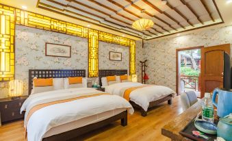 The bedroom features two white beds and a wood-paneled accent wall in the middle at Zhouzhuang Latte Play Stone Mulan Hotel