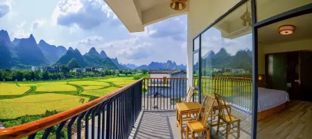 Yangshuo Yuchishe Homestay (Yulonghe Zhuyu Drifting Jinlong Bridge Wharf) Отели рядом с достопримечательностью «Li River Scenic Area»