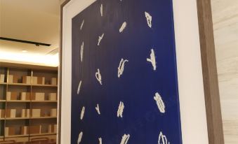 A painting by an artist is displayed in the lobby at Art Basel Miami Beach at Ji Hotel (Shanghai Hongqiao Shuicheng Road)