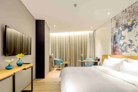 M Hotel Отели рядом с достопримечательностью «University for Science & Technology Zhengzhou»