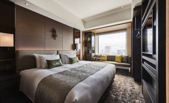 a large bed with white sheets and a brown headboard is in a room with a window at The Royal Park Hotel Iconic Osaka Midosuji