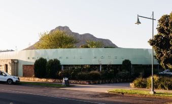 "a large building with a green roof and the words "" west slope mountain "" on it" at Royal Mail Hotel