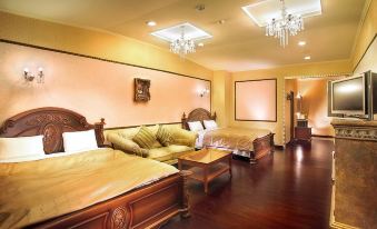 a luxurious bedroom with wooden flooring , white walls , and large windows , featuring two couches , a coffee table , and a chandelier at Huis Ten Bosch
