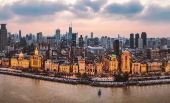 From a high vantage point, one can see a cityscape with buildings and bodies of water in the foreground at Yuzhan No.8 Art Hotel (Shanghai Beach Branch)