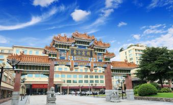 The hotel complex consists of a large building with a main entrance and a smaller structure on one side, each with its own separate entrance at Dong Fang Hotel