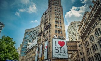 "A large building displays the words ""I love you"" along with another sign" at Yitel Premium (Shanghai people's Square Nanjing Road Pedestrian Street shop)