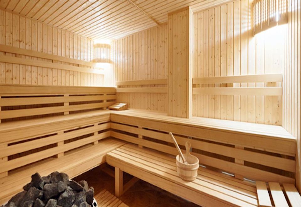 The wooden sauna features wood paneling and is accompanied by an outdoor jacuzzi at Covillea Bukit Jalil Room