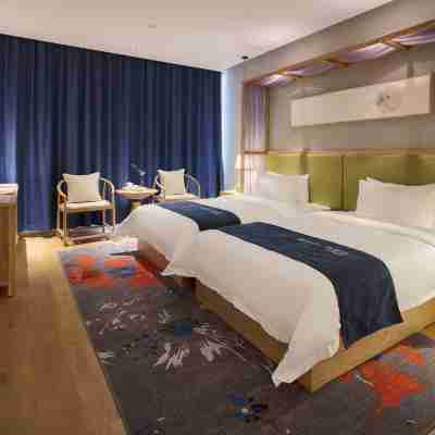 仟那酒店(新鄉華蘭大道胖東來購物廣場店) Rooms