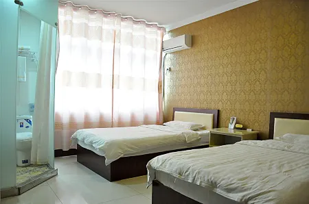 Youpeng Business Hotel Отели рядом со станцией Junanbei Railway Station