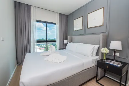 Dlux Condominium Отели рядом с достопримечательностью «Aussie Divers Phuket»